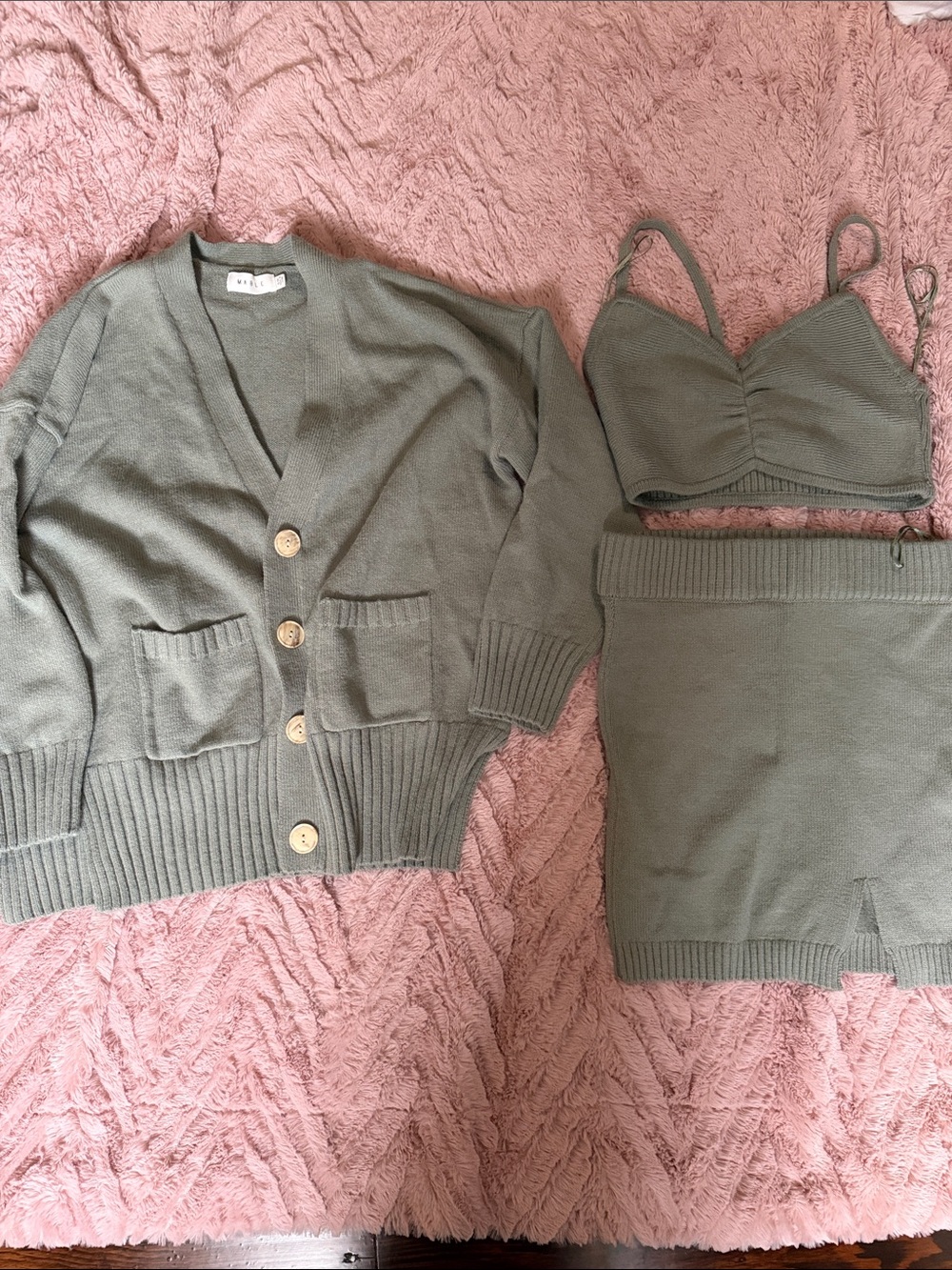 Three piece outfit. Never used comes with the cardigan, skirt and crop top.
